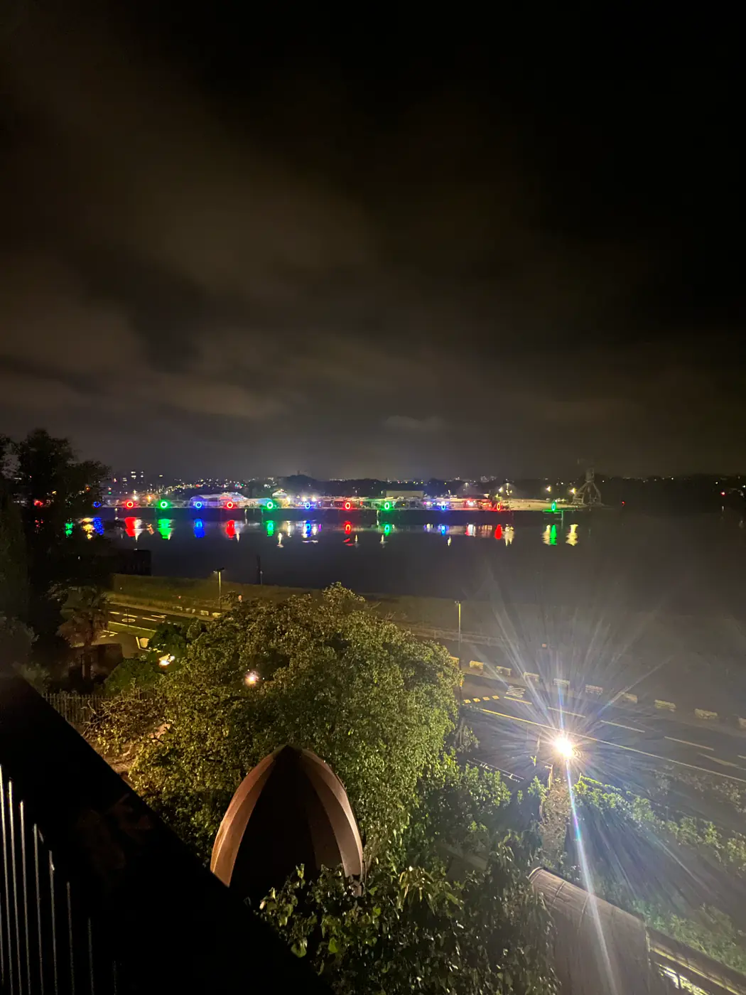 Night view of the illuminated Anneaux de Buren, from Butte Sainte-Anne, in Nantes